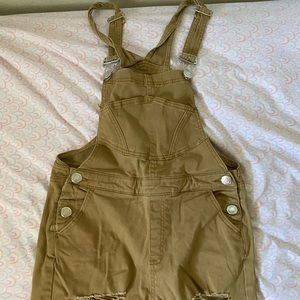 Brown ripped jeans overall.